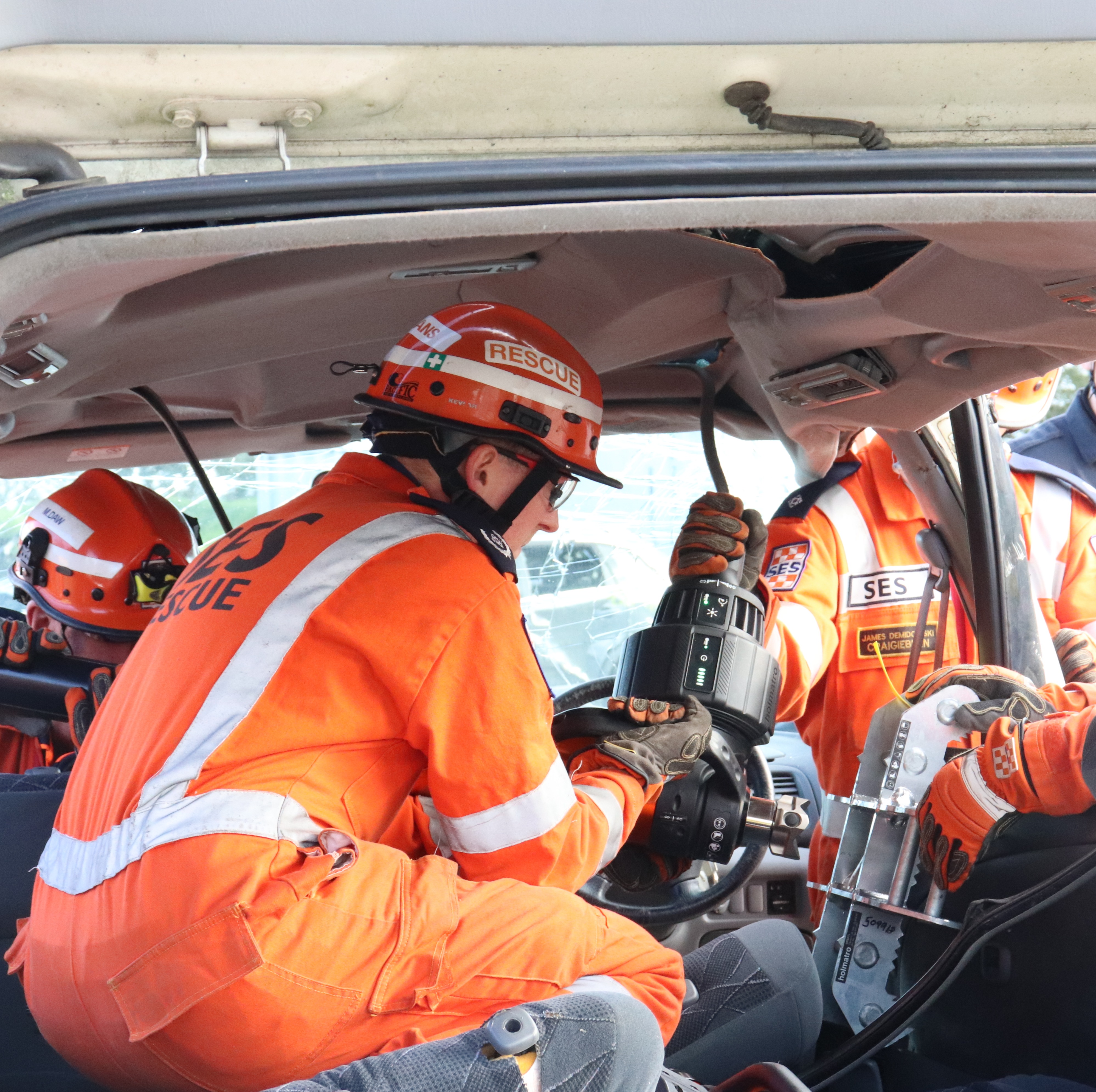 VICSES Trainer Jackson Evans uses Holmatro tools to access a crashed vehicle.